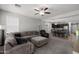Spacious living room with comfortable seating and seamless flow into the dining and kitchen areas at 17038 W Mohave St, Goodyear, AZ 85338