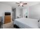 A comforting main bedroom with neutral walls, ceiling fan, and plush carpeting at 17038 W Mohave St, Goodyear, AZ 85338
