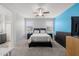 The main bedroom features a calming color scheme, ceiling fan and plush carpeting at 17038 W Mohave St, Goodyear, AZ 85338