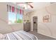 Baseball themed bedroom with striped bedding, and a closet for storage and organization at 17154 W Las Palmaritas Dr, Waddell, AZ 85355