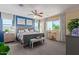 Serene bedroom with a king-sized bed, stylish decor, and bright windows offering views at 17154 W Las Palmaritas Dr, Waddell, AZ 85355