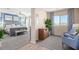 Spacious bedroom suite with blue accent wall, seating area, and lots of natural light at 17154 W Las Palmaritas Dr, Waddell, AZ 85355