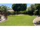 Well-maintained backyard with lush lawn and landscaping, providing an ideal play area at 17658 N 52Nd Pl, Scottsdale, AZ 85254