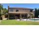 Expansive home backyard with a covered patio, perfect for entertaining and enjoying the outdoors at 17658 N 52Nd Pl, Scottsdale, AZ 85254