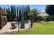 An inviting backyard pool is surrounded by lush landscaping and lounge chairs, creating a private outdoor oasis at 17658 N 52Nd Pl, Scottsdale, AZ 85254