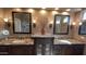 Spacious bathroom with double sinks, granite countertops, and dark wood cabinetry at 17658 N 52Nd Pl, Scottsdale, AZ 85254