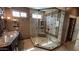 Luxury bathroom with a glass-enclosed shower and granite countertops at 17658 N 52Nd Pl, Scottsdale, AZ 85254