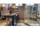 Bathroom featuring granite counters, dark wood cabinets, and a tiled walk-in shower at 17658 N 52Nd Pl, Scottsdale, AZ 85254