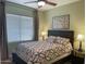 Cozy bedroom featuring a queen-size bed and a ceiling fan, offering a relaxing retreat at 17658 N 52Nd Pl, Scottsdale, AZ 85254