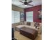 Comfortable bonus room featuring a sectional sofa and an ottoman, perfect for relaxation at 17658 N 52Nd Pl, Scottsdale, AZ 85254