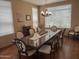 Dining room with a large table, neutral color walls, and natural lighting at 17658 N 52Nd Pl, Scottsdale, AZ 85254