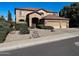Charming two-story home with a well-manicured front yard and a three car garage at 17658 N 52Nd Pl, Scottsdale, AZ 85254