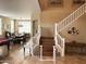 Elegant foyer featuring hardwood floors, staircase, and a view into the dining room at 17658 N 52Nd Pl, Scottsdale, AZ 85254