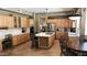 Modern kitchen with stainless steel appliances, marble countertops, and a wine rack island at 17658 N 52Nd Pl, Scottsdale, AZ 85254