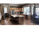 Modern kitchen with stainless steel appliances, marble countertops, and a wine rack island at 17658 N 52Nd Pl, Scottsdale, AZ 85254