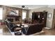 Cozy living room featuring a stone fireplace, plush seating, and natural light at 17658 N 52Nd Pl, Scottsdale, AZ 85254