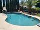 Sparkling pool with beach balls, basketball hoop, and lush landscaping at 17658 N 52Nd Pl, Scottsdale, AZ 85254