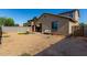 View of a backyard with a dirt ground and a table with chairs at 17946 W Via Del Sol --, Surprise, AZ 85387