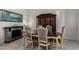 Traditional dining room with a stone fireplace, modern light fixture, and a wooden hutch for storage at 17946 W Via Del Sol --, Surprise, AZ 85387