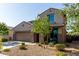 Two-story stucco home featuring a two-car garage, low maintenance landscaping, and covered entryway at 17946 W Via Del Sol --, Surprise, AZ 85387
