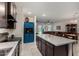 Bright kitchen with stainless steel appliances and an island featuring speckled countertops at 17946 W Via Del Sol --, Surprise, AZ 85387