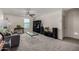 Living room featuring a ceiling fan, gray sofa, and a table at 17946 W Via Del Sol --, Surprise, AZ 85387