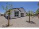 Well maintained backyard featuring desert landscaping for easy upkeep and privacy at 18766 N Salerno Dr, Maricopa, AZ 85138