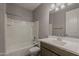 Bathroom featuring a bathtub, vanity, mirror, and a toilet, combining comfort with modern design at 18766 N Salerno Dr, Maricopa, AZ 85138