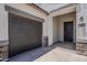 Exterior front door showing the entry and garage at 18766 N Salerno Dr, Maricopa, AZ 85138