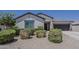 Charming single-story home featuring desert landscaping and a two-car garage at 18766 N Salerno Dr, Maricopa, AZ 85138
