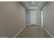 Hallway view towards the front entry at 18766 N Salerno Dr, Maricopa, AZ 85138