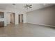 Open-concept living room featuring neutral walls and tiled floors at 18766 N Salerno Dr, Maricopa, AZ 85138