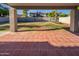 Covered back patio with tiled flooring looking out to a spacious backyard at 1901 E Hearn Rd, Phoenix, AZ 85022