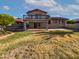 Expansive backyard with lush lawn, mature trees, and a spacious patio for outdoor entertaining at 1901 E Hearn Rd, Phoenix, AZ 85022