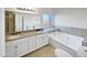 Spa-like bathroom with double sinks, granite countertops, and a large soaking tub at 1901 E Hearn Rd, Phoenix, AZ 85022