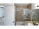 Modern bathroom featuring a tiled shower with glass door and granite counter at 1901 E Hearn Rd, Phoenix, AZ 85022