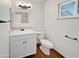 Modern bathroom features vanity with decorative backsplash and a toilet at 1901 E Hearn Rd, Phoenix, AZ 85022