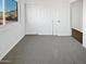 Bright bedroom with large closet, neutral carpet and a backyard view at 1901 E Hearn Rd, Phoenix, AZ 85022