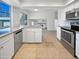 Bright kitchen featuring stainless steel appliances, light countertops, and tile flooring at 1901 E Hearn Rd, Phoenix, AZ 85022