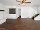 Open living space with modern ceiling fan, hardwood floors, and a built-in bar area at 1901 E Hearn Rd, Phoenix, AZ 85022