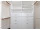 Organized walk-in closet with built-in shelving and drawers, maximizing storage space at 19318 E Reins Rd, Queen Creek, AZ 85142