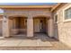 Close-up of the charming front porch with decorative railings and a secure screen door at 19318 E Reins Rd, Queen Creek, AZ 85142
