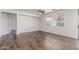 Bright living room features modern flooring, a ceiling fan, and ample natural light at 19318 E Reins Rd, Queen Creek, AZ 85142