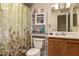 Bright bathroom featuring a vanity, toilet, and decorative shower curtain at 1951 E Del Sur Dr, Tempe, AZ 85283