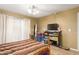 Bedroom with hardwood floors, natural light, and neutral-colored walls at 1951 E Del Sur Dr, Tempe, AZ 85283