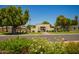 Inviting community entrance with lush landscaping and well-maintained gate at 1951 E Del Sur Dr, Tempe, AZ 85283