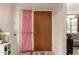 Entryway with a wood door, decorated with a red patterned curtain, and direct access to living spaces at 1951 E Del Sur Dr, Tempe, AZ 85283