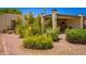 Landscaped home with desert plants, creating an inviting entrance and low-maintenance charm at 1951 E Del Sur Dr, Tempe, AZ 85283