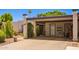 Inviting home with a covered parking spot, desert landscaping, and direct access to the front door at 1951 E Del Sur Dr, Tempe, AZ 85283