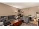 Comfortable living room offering a relaxed atmosphere, including neutral tones, a piano, and cozy seating at 1951 E Del Sur Dr, Tempe, AZ 85283